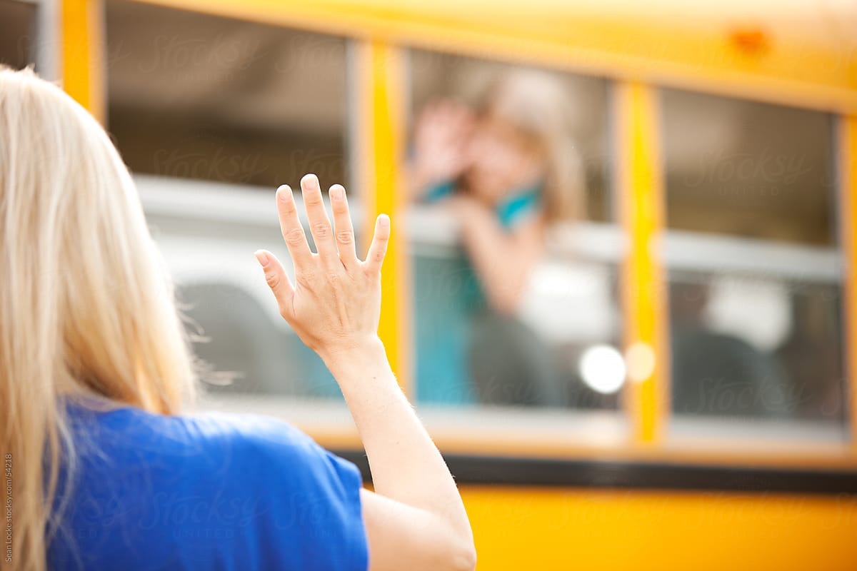 kids waving goodbye at school